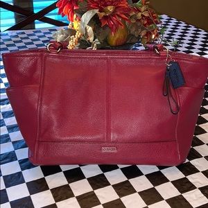 Coach red shoulder strap purse.